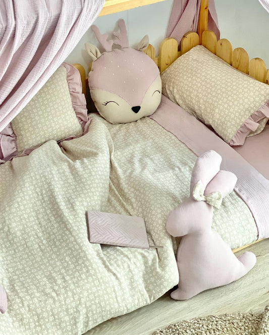 Handmade cotton muslin toddler duvet cover set with animal print styling on wooden Montessori kids bed