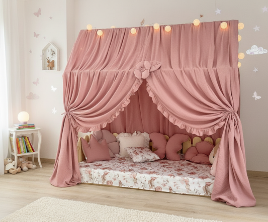 Dusty rose canopy with ruffles over Montessori floor bed