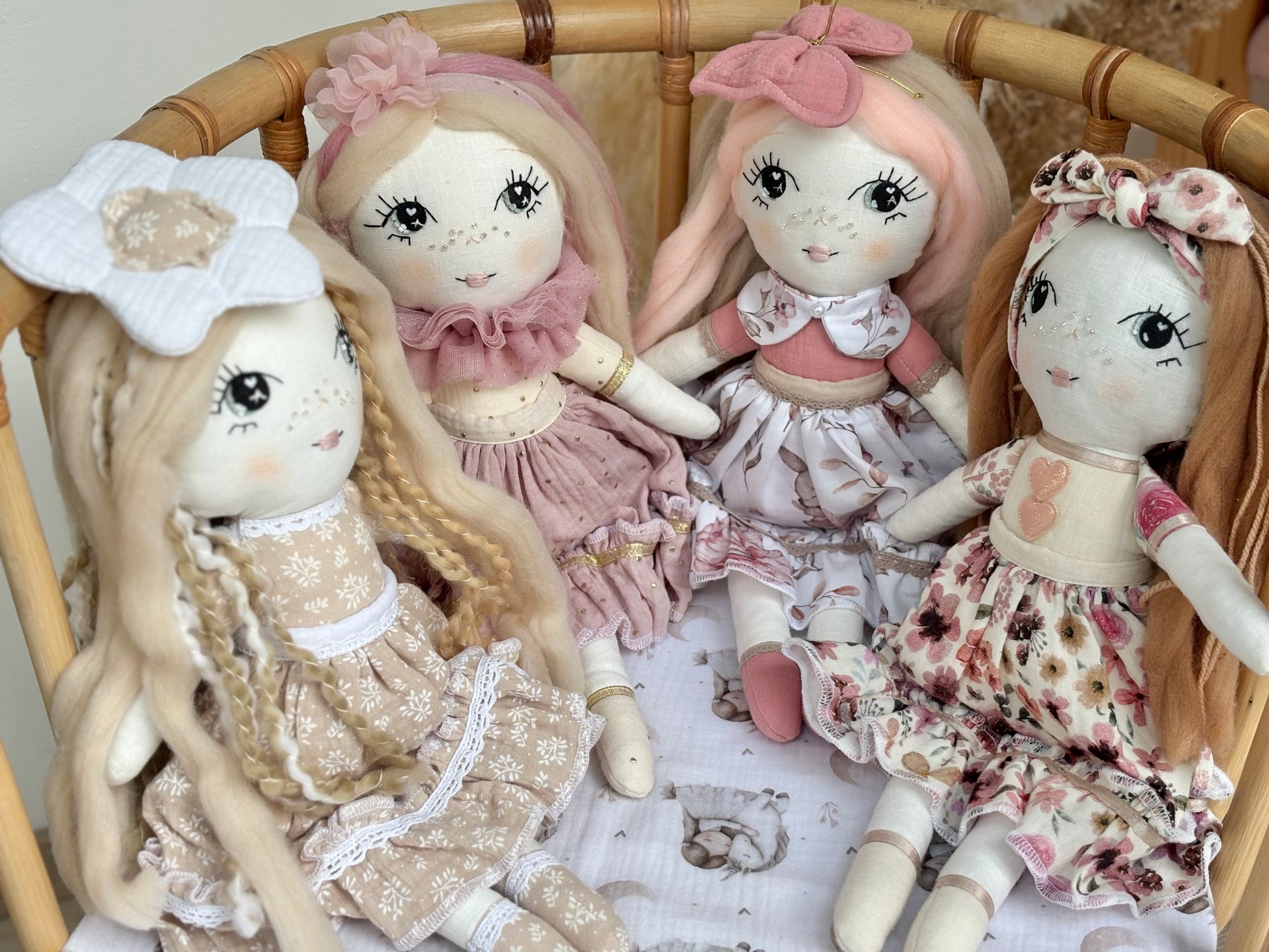 Handmade cloth doll in blush pink dress with hand-stitched face and long hair, heirloom fabric doll for nursery décor and baby gift