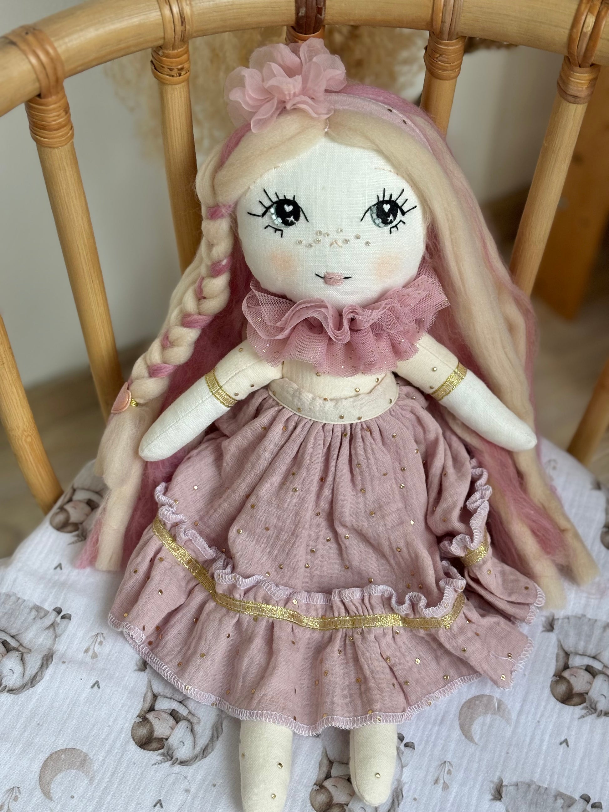 Handmade cloth doll in blush pink dress with hand-stitched face and long hair, heirloom fabric doll for nursery décor and baby gift