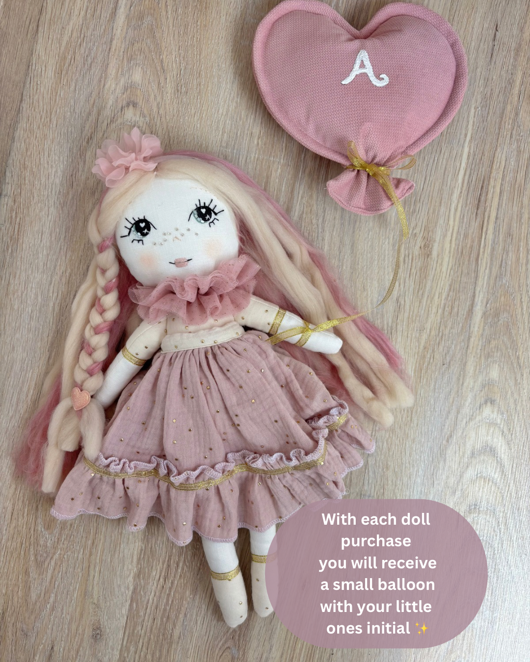 Handmade cloth doll in blush pink dress with hand-stitched face and long hair, heirloom fabric doll for nursery décor and baby gift